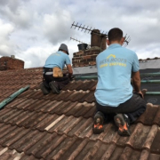 the Beta Roofs Team on a roof